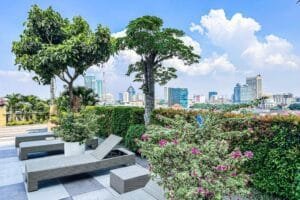 Poolside sunbeds at Trillium Residence Surabaya