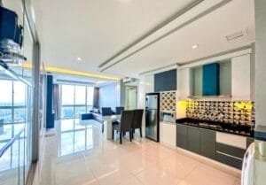 Dapur dan ruang tamu apartemen 2br sophisticated surabaya di via tower ciputra world