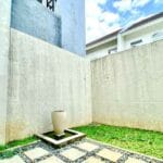 Taman belakang serene 3br family house di northwest park west surabaya
