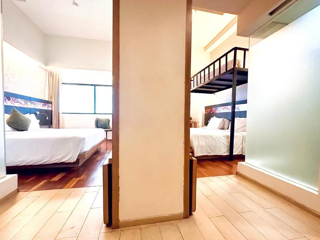 Family suite with separate sleeping areas at MaxOne Dharmahusada