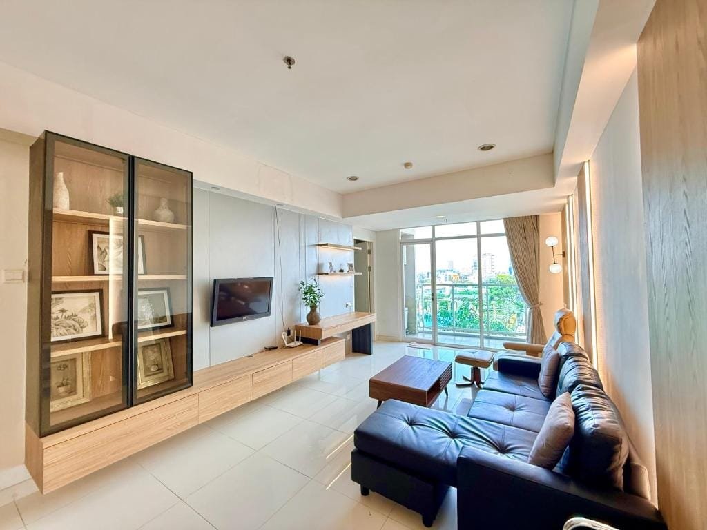 Living room and balcony at Modern Chic 2BR Trillium Surabaya