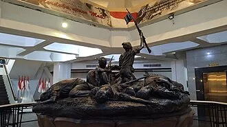 A bronze statue depicting the struggle of Surabaya Battle on 10 November 1945. Located inside the Heroes Monument complex, Surabaya, Indonesia